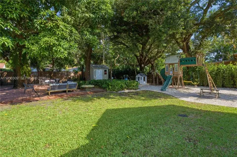 a swimming pool with outdoor seating and yard