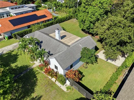 an aerial view of a house with a garden
