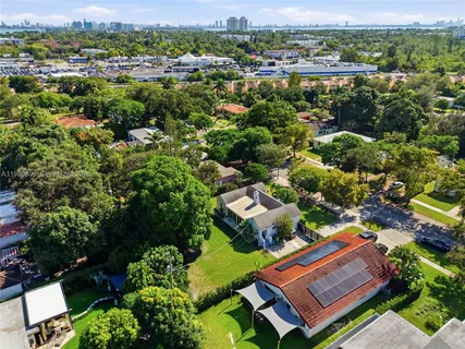 an aerial view of a house with a garden
