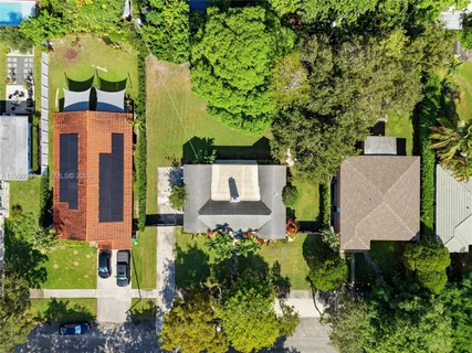 an aerial view of a house with a garden