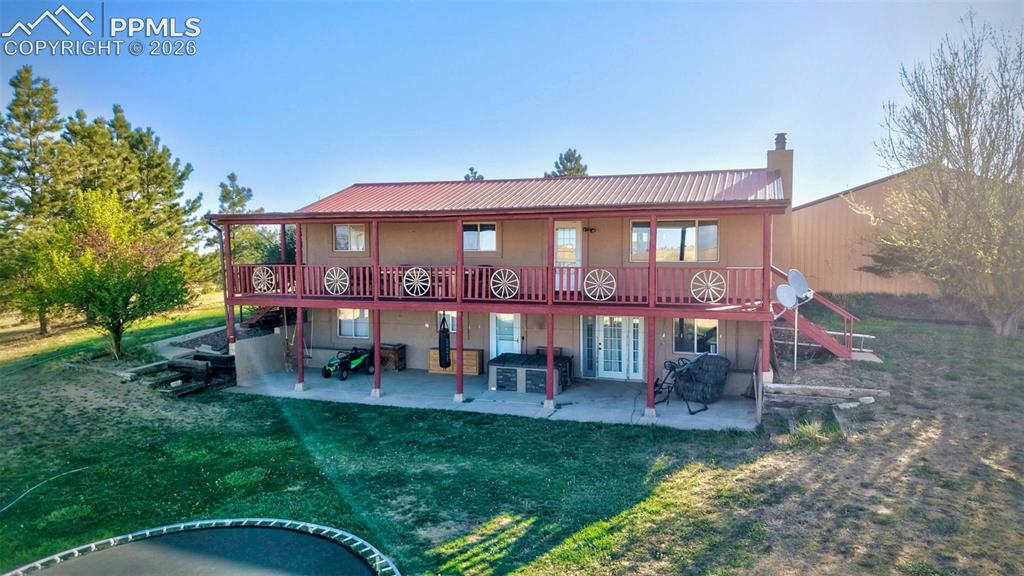 18560 Chelton Road Ramah, CO 80832 - Photo 29 of 34 a view of a building with a yard