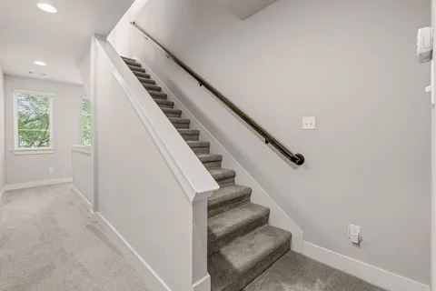 an entryway in a hall with a window
