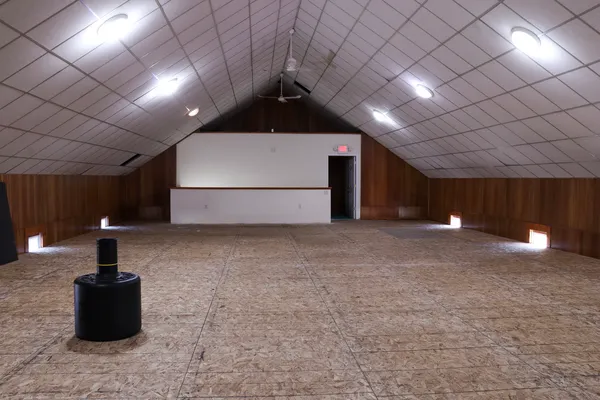 a room that has a bed and a table in it