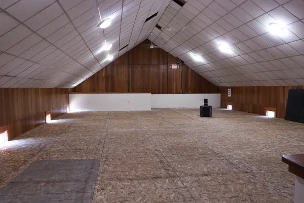 a room that has a rug and tent in it