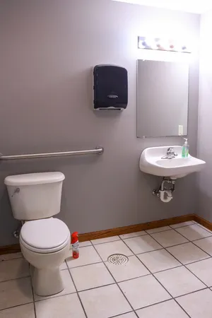 a view of a room with wooden floor and chair