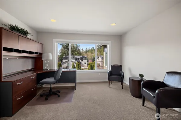 a view of a livingroom with furniture and windows