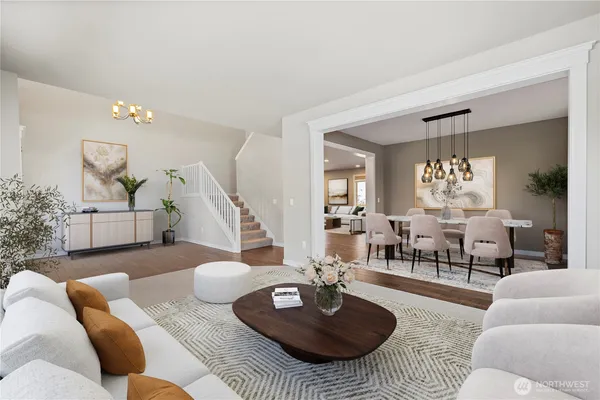 a living room with furniture and a table