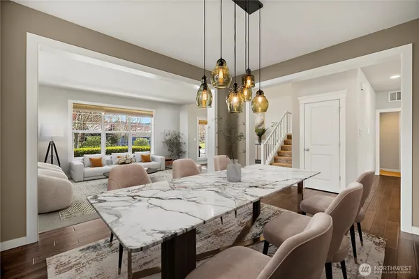 a view of a dining room with furniture wooden floor and chandelier