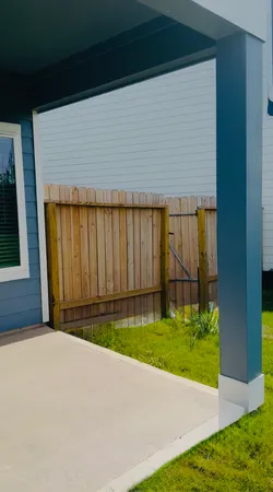 a view of backyard with tub