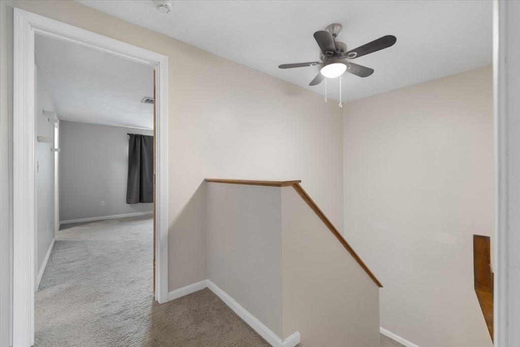 28 Southbridge Road, Unit 302 Charlton, MA 01507 - Photo 11 of 27 a view of a hallway with a ceiling fan