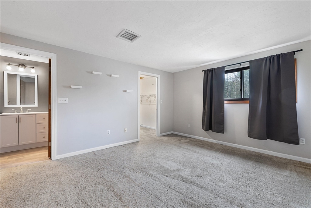 28 Southbridge Road, Unit 302 Charlton, MA 01507 - Photo 12 of 27 an empty room with windows and closet