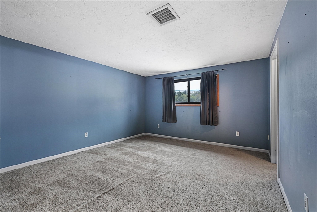 28 Southbridge Road, Unit 302 Charlton, MA 01507 - Photo 15 of 27 a view of an empty room with a window
