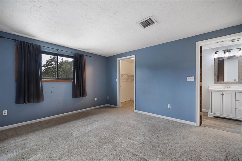 28 Southbridge Road, Unit 302 Charlton, MA 01507 - Photo 16 of 27 an empty room with windows and closet