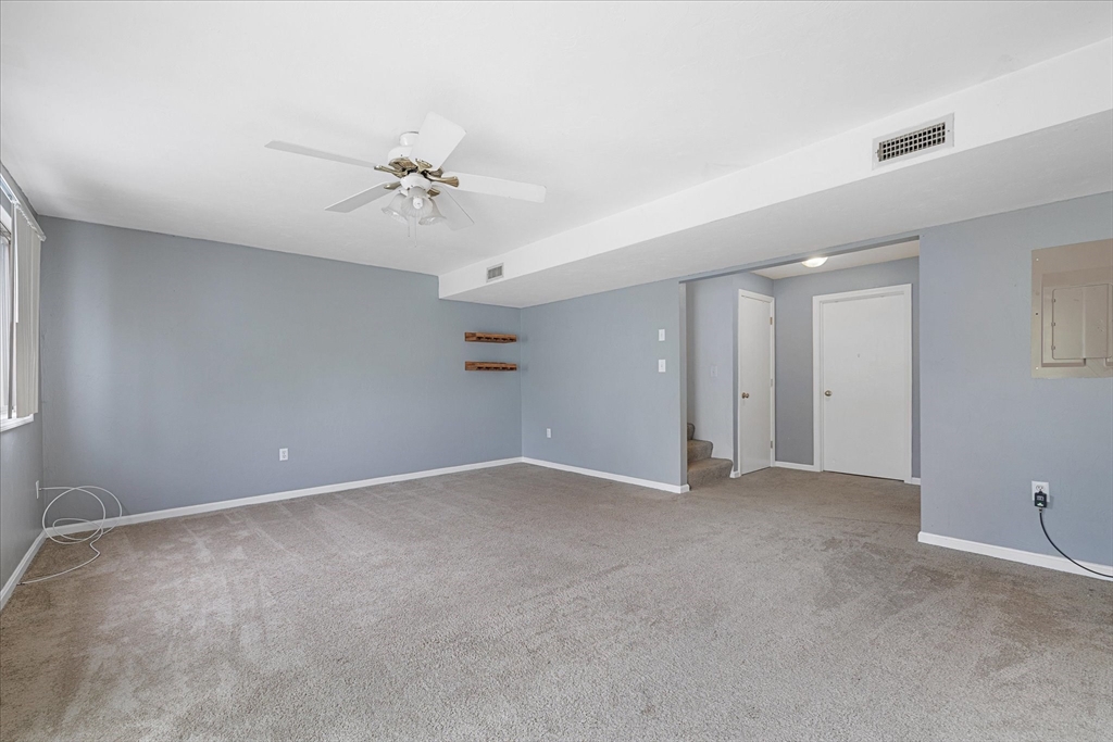 28 Southbridge Road, Unit 302 Charlton, MA 01507 - Photo 18 of 27 a view of an empty room with a ceiling fan