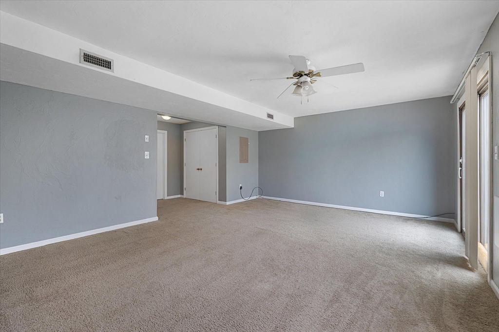 28 Southbridge Road, Unit 302 Charlton, MA 01507 - Photo 20 of 27 a view of an empty room with a ceiling fan