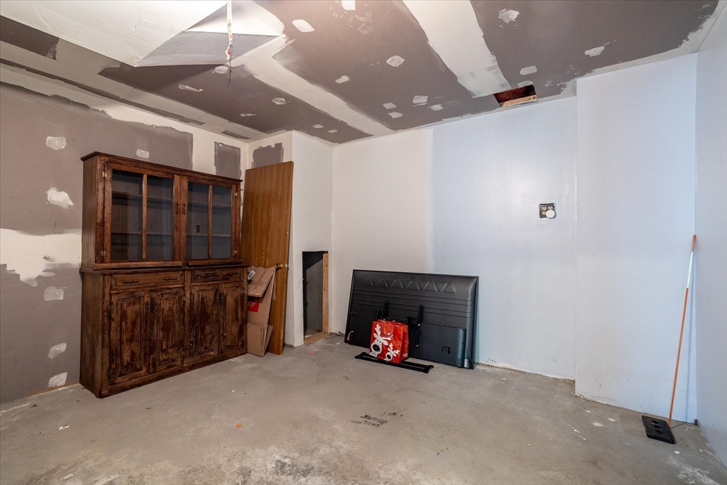 28 Southbridge Road, Unit 302 Charlton, MA 01507 - Photo 22 of 27 a view of an empty room with a fireplace