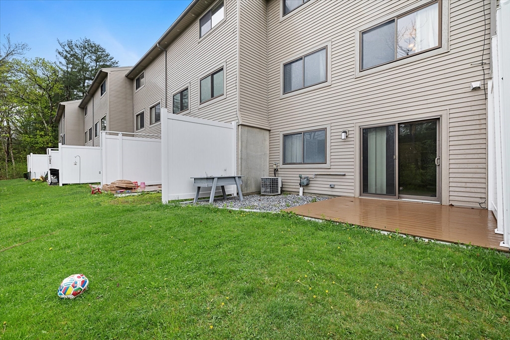 28 Southbridge Road, Unit 302 Charlton, MA 01507 - Photo 24 of 27 a view of a house with backyard sitting area and garden