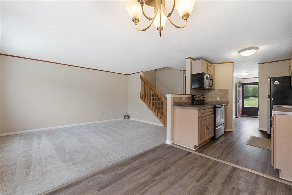 28 Southbridge Road, Unit 302 Charlton, MA 01507 - Photo 5 of 27 a kitchen with cabinets and steel stainless steel appliances