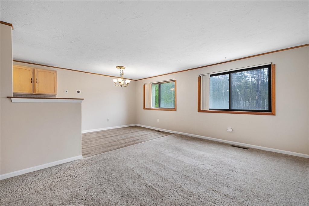 28 Southbridge Road, Unit 302 Charlton, MA 01507 - Photo 7 of 27 a view of an empty room with a window