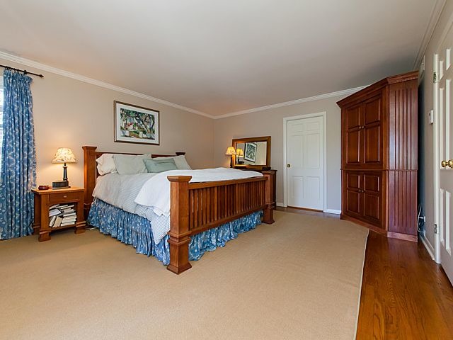 901 South County Line Road Hinsdale, IL 60521 - Photo 11 of 25 a bedroom with a bed and a night stand