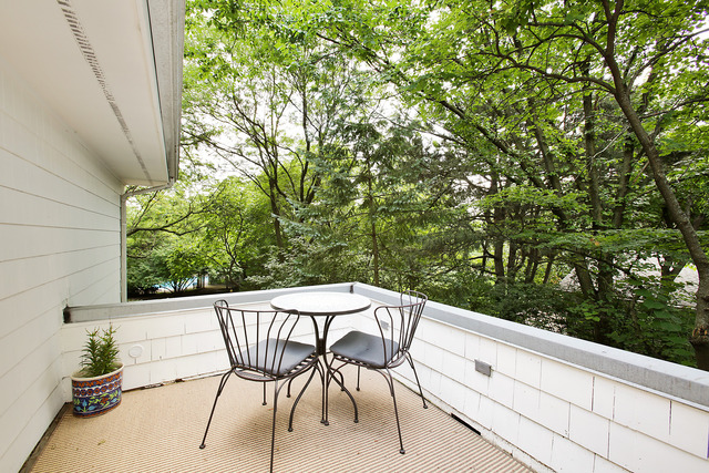 901 South County Line Road Hinsdale, IL 60521 - Photo 12 of 25 a roof deck with table and chairs and potted plants
