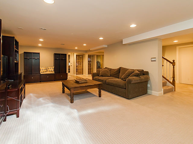 901 South County Line Road Hinsdale, IL 60521 - Photo 19 of 25 a living room with furniture and a flat screen tv
