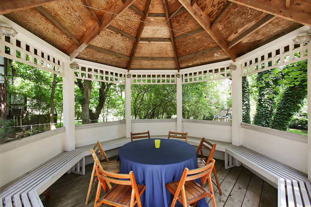 901 South County Line Road Hinsdale, IL 60521 - Photo 23 of 25 a view of an outdoor space with furniture and umbrella