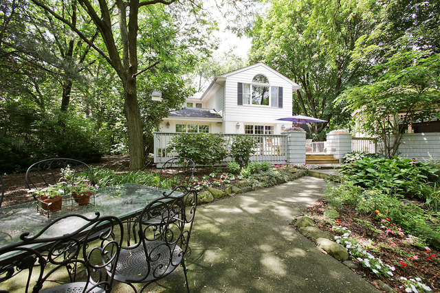 901 South County Line Road Hinsdale, IL 60521 - Photo 24 of 25 a front view of a house with a yard and trees