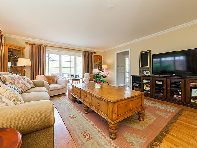 901 South County Line Road Hinsdale, IL 60521 - Photo 6 of 25 a living room with furniture and a flat screen tv
