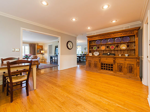 901 South County Line Road Hinsdale, IL 60521 - Photo 8 of 25 a living room with furniture and a table with wooden floor