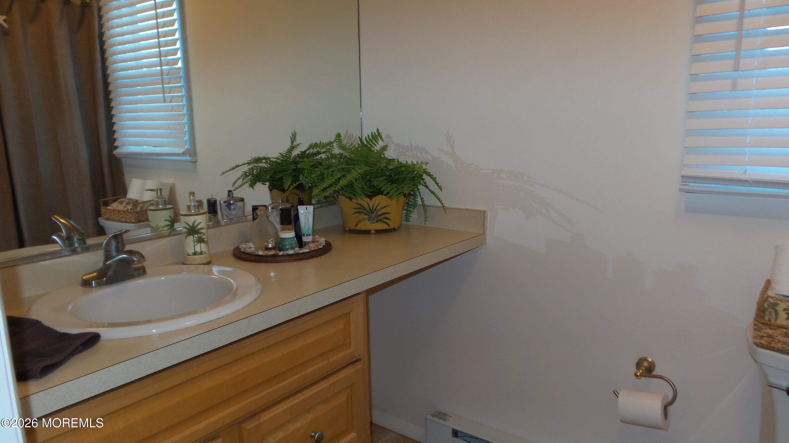 12 Barker Street Brick, NJ 08724 - Photo 13 of 17 a bathroom with a sink and a mirror