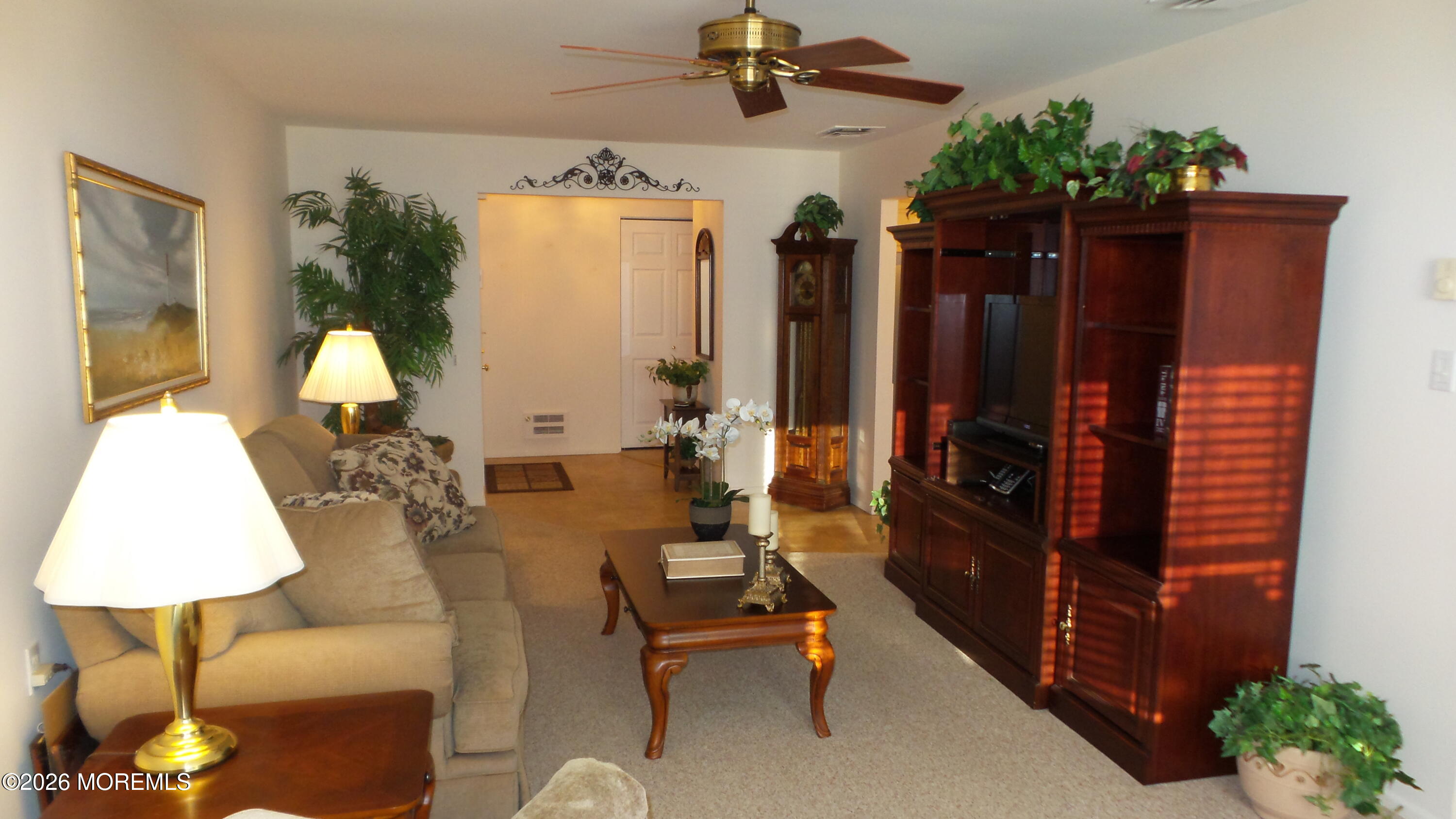 12 Barker Street Brick, NJ 08724 - Photo 4 of 17 a living room with furniture and a lamp