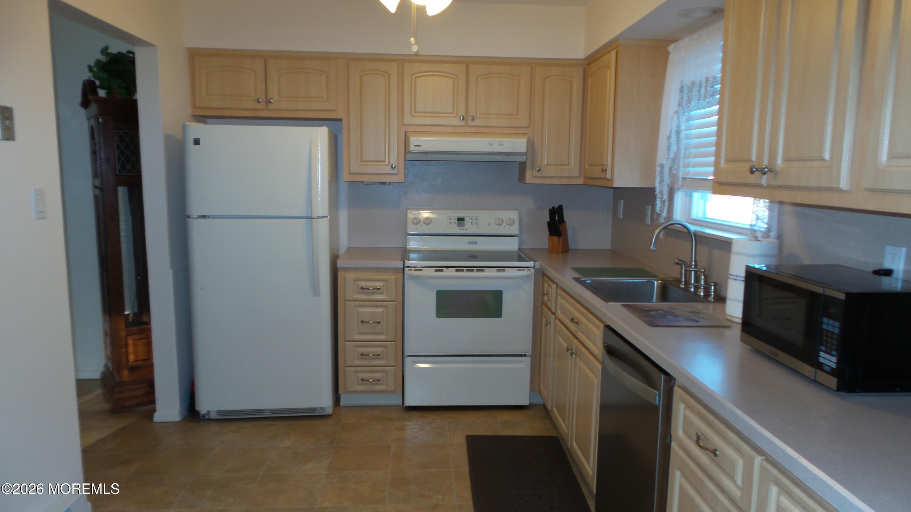 12 Barker Street Brick, NJ 08724 - Photo 9 of 17 a kitchen with cabinets and stainless steel appliances