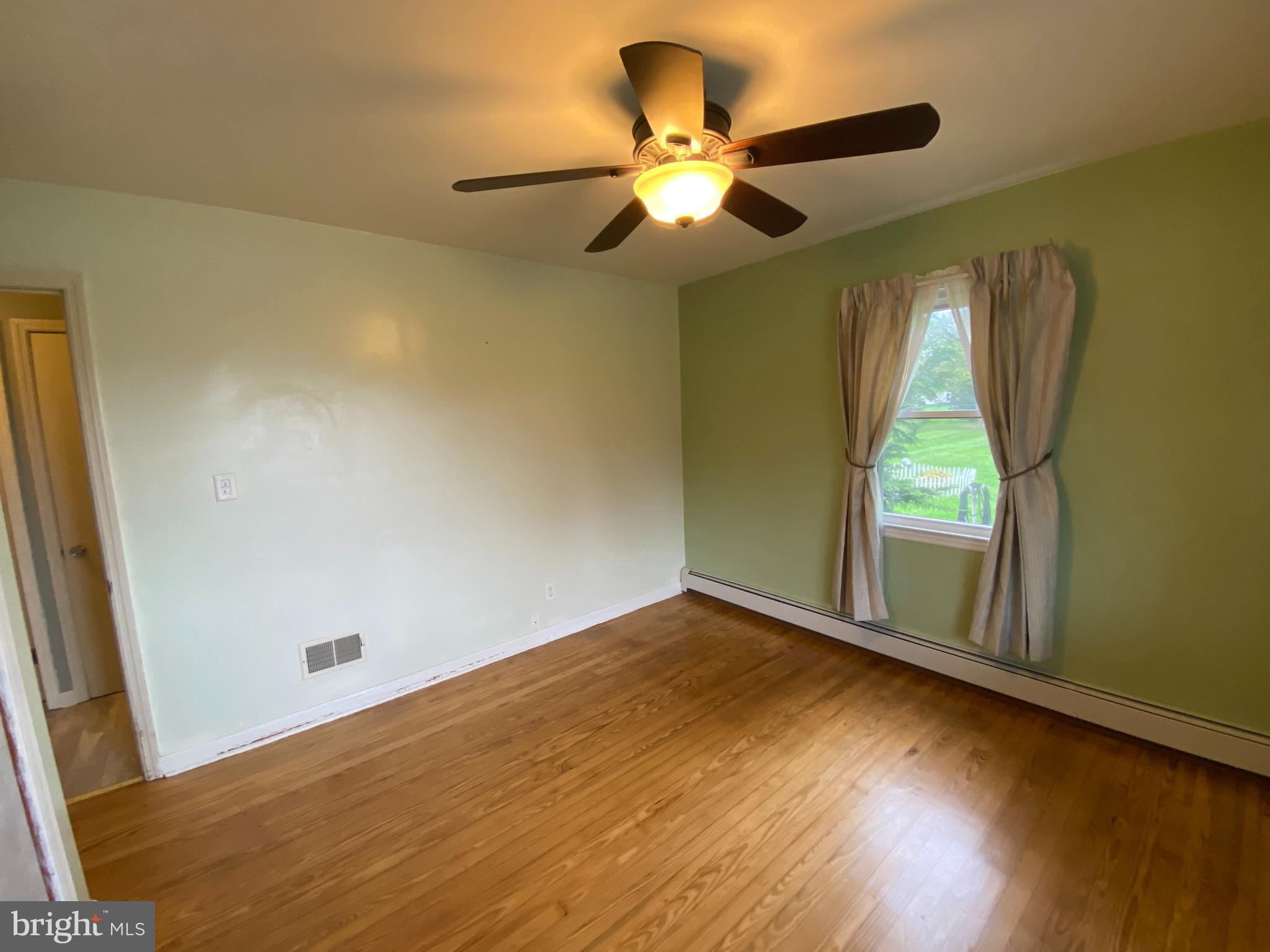 951 Hoffer Road Annville, PA 17003 - Photo 25 of 40 1st floor bedroom with oak hardwood floor.