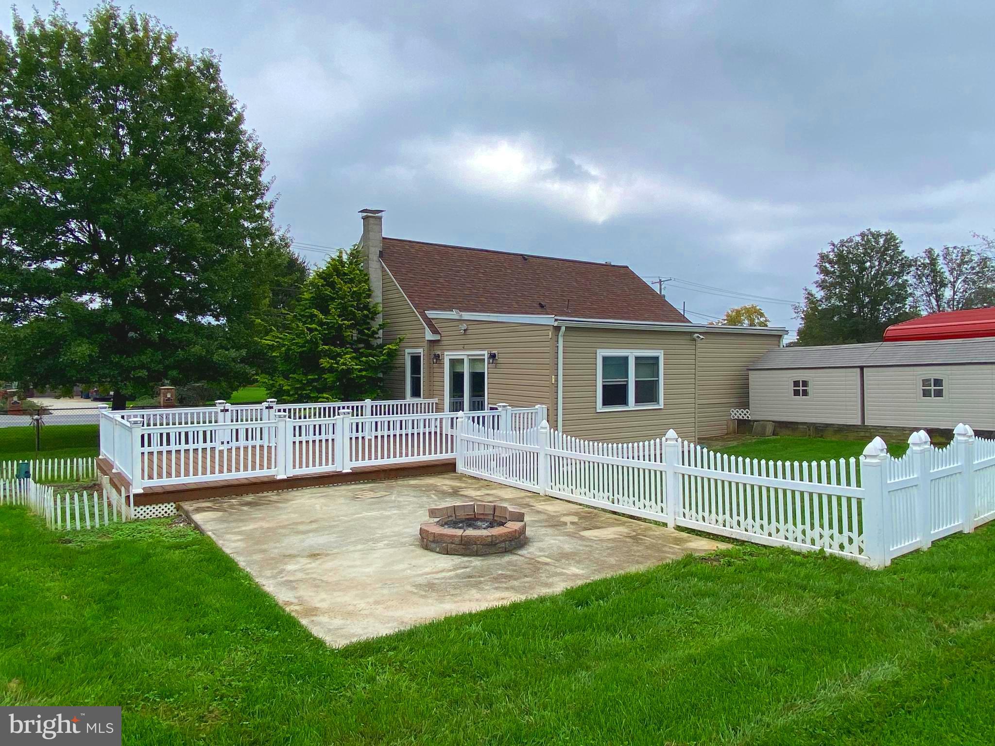 Backyard with patio and firepit.