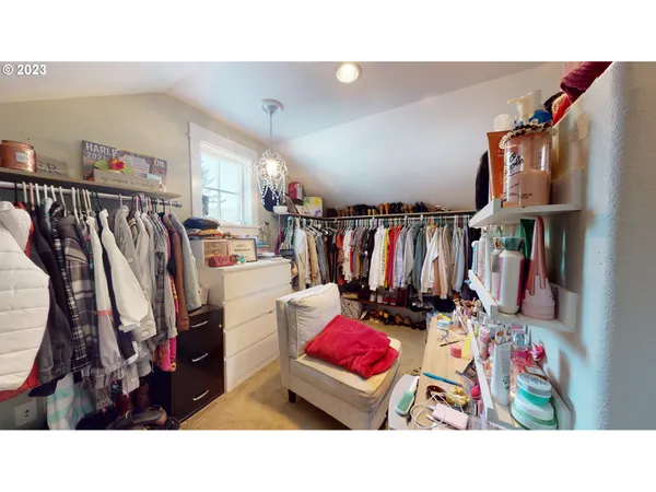 a bathroom with a sink mirror vanity and toilet