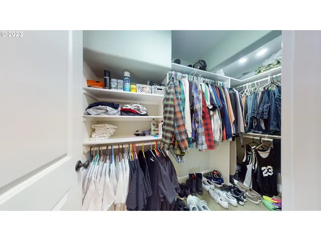 a living room with a bed furniture and a window