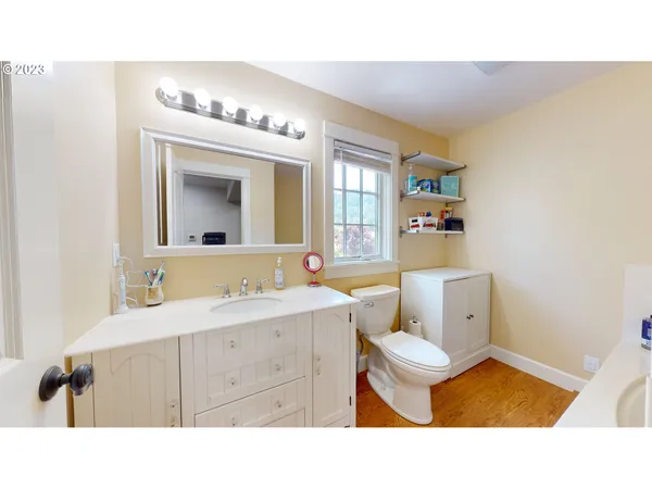 a bathroom with a tub and toilet