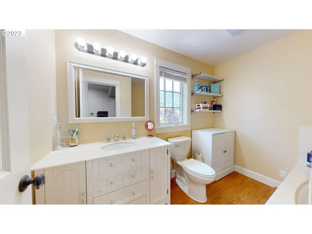 a bathroom with a tub and toilet