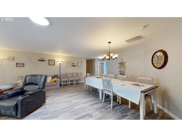 a kitchen with white cabinets and refrigerator