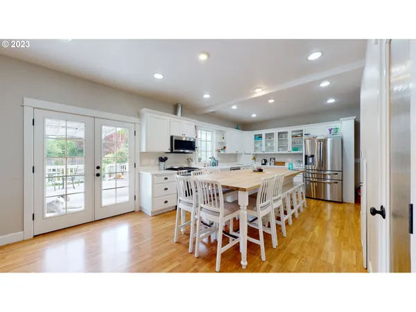 a open kitchen with a table and chairs