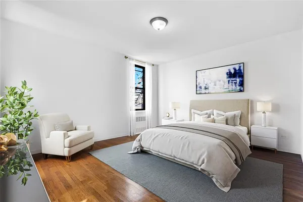 a bedroom with a bed and a couch