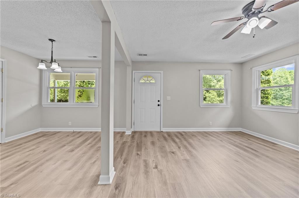 260 Pilotview Loop Madison, NC 27025 - Photo 8 of 22 WHAT A WONDERFUL OPEN PLAN WITH NEW LVP FLOORING