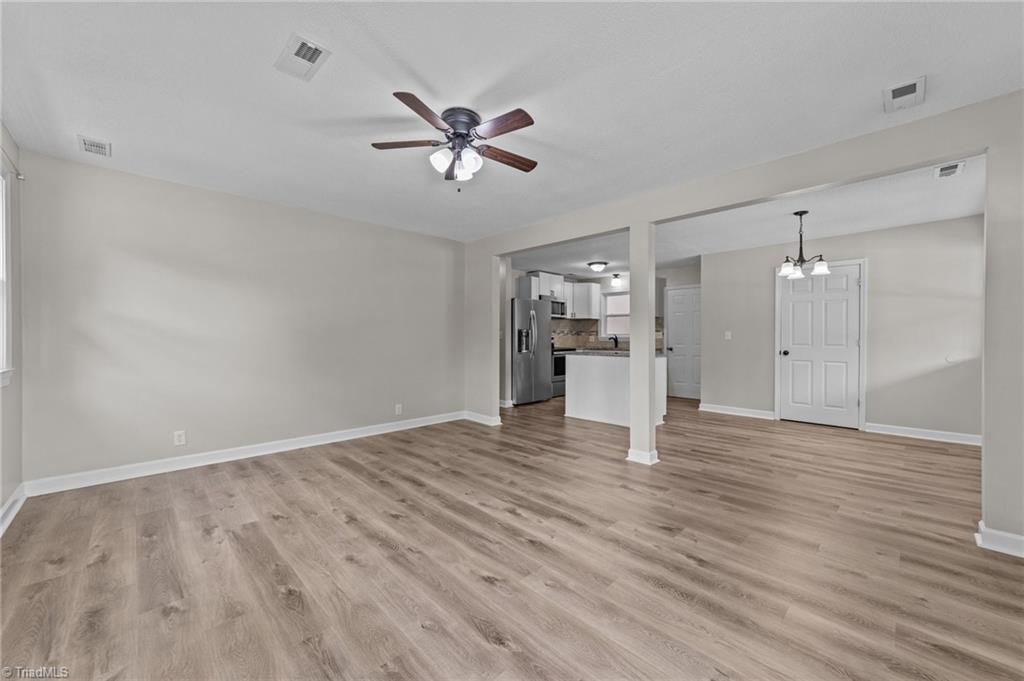 260 Pilotview Loop Madison, NC 27025 - Photo 9 of 22 GREAT ROOM HAS CEILING FAN AND IS OPEN TO THE KITCHENA ND DINING