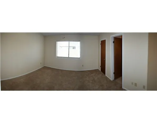 a black and white photo of a living room