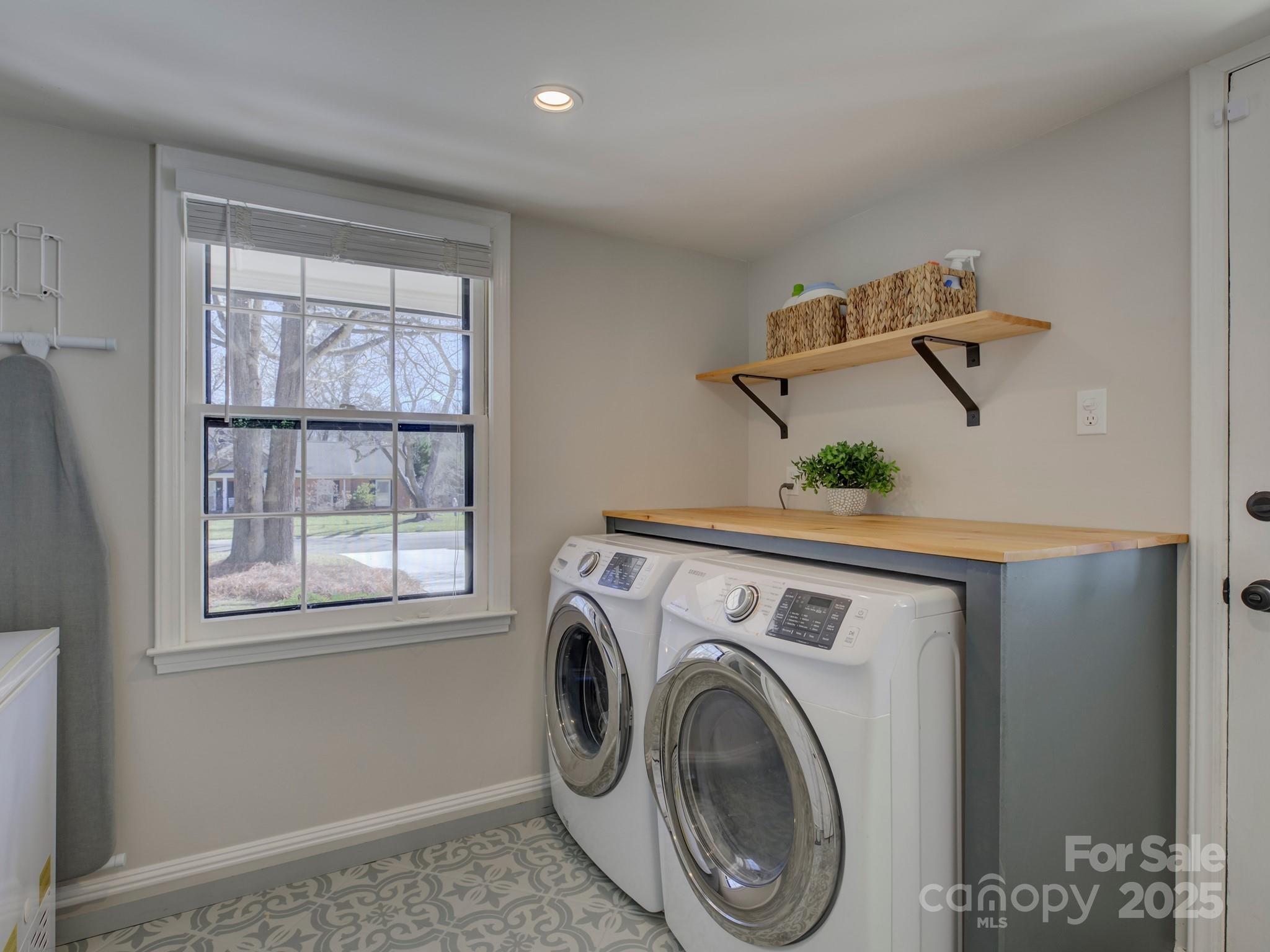 1225 Braeburn Road Charlotte, NC 28211 - Photo 11 of 45 a view of a hallway with washer and dryer