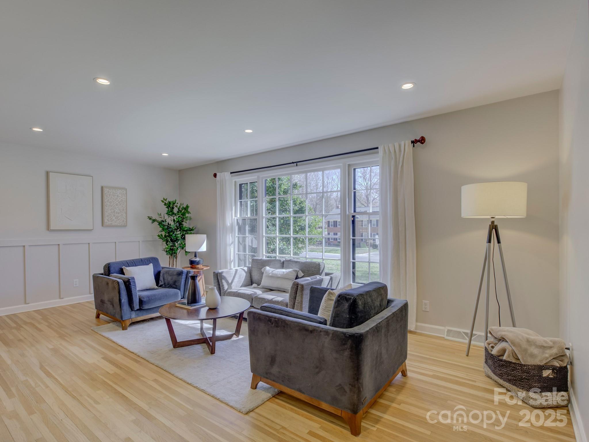 1225 Braeburn Road Charlotte, NC 28211 - Photo 12 of 45 a living room with furniture and a potted plant