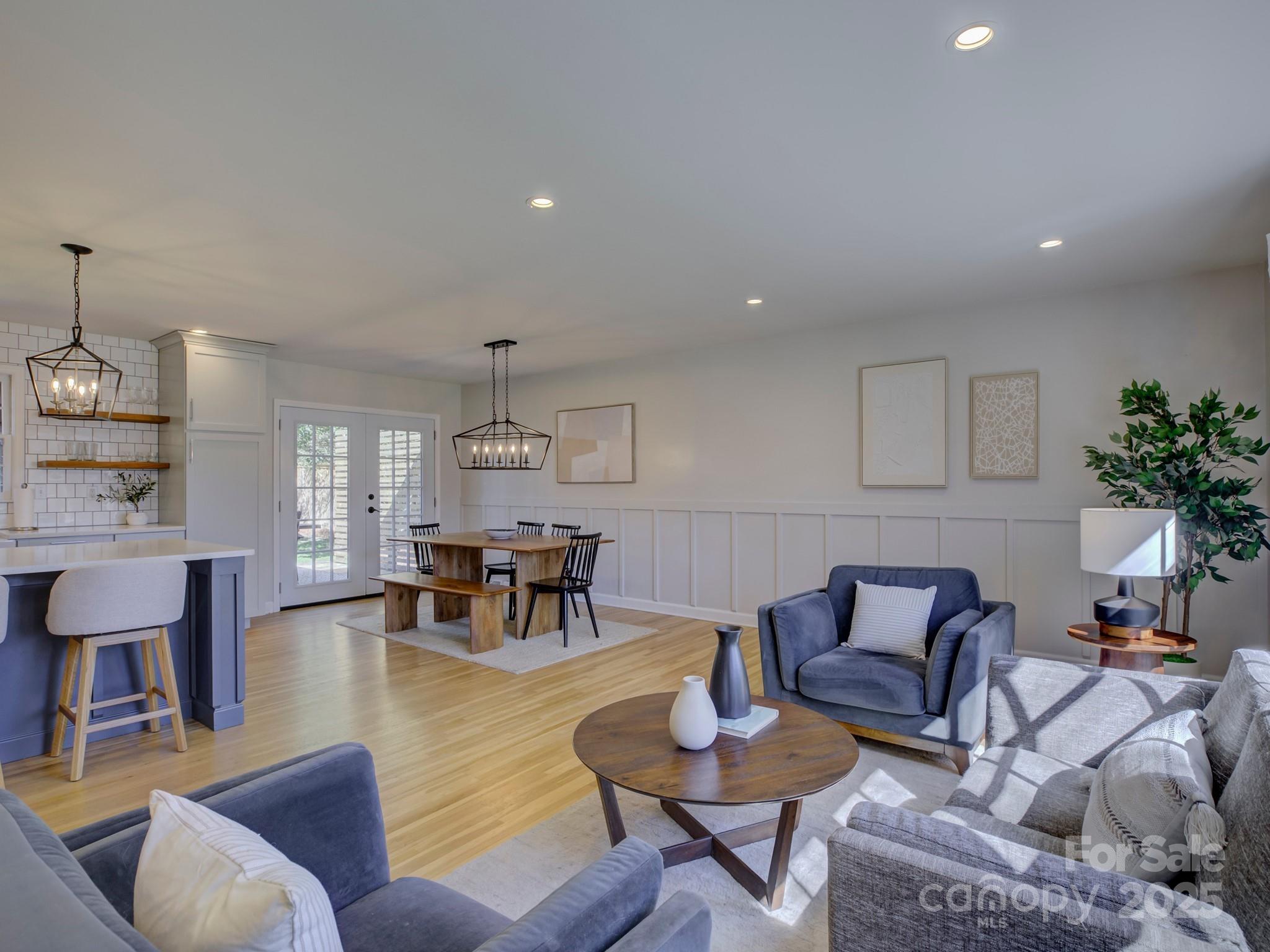 1225 Braeburn Road Charlotte, NC 28211 - Photo 14 of 45 a living room with furniture and a chandelier