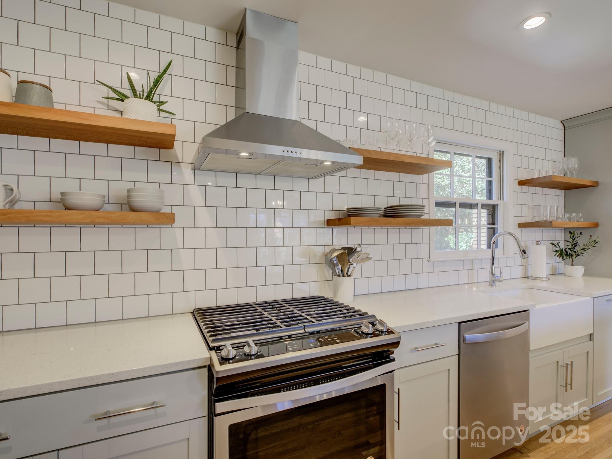 1225 Braeburn Road Charlotte, NC 28211 - Photo 19 of 45 a stove top oven sitting inside of a kitchen