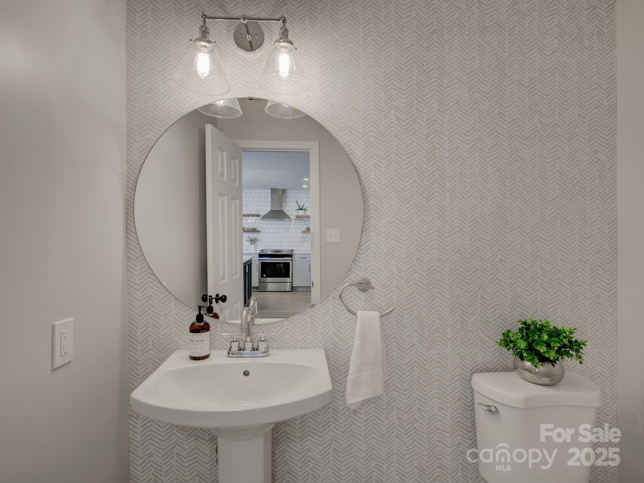 1225 Braeburn Road Charlotte, NC 28211 - Photo 22 of 45 a bathroom with a sink toilet and a mirror